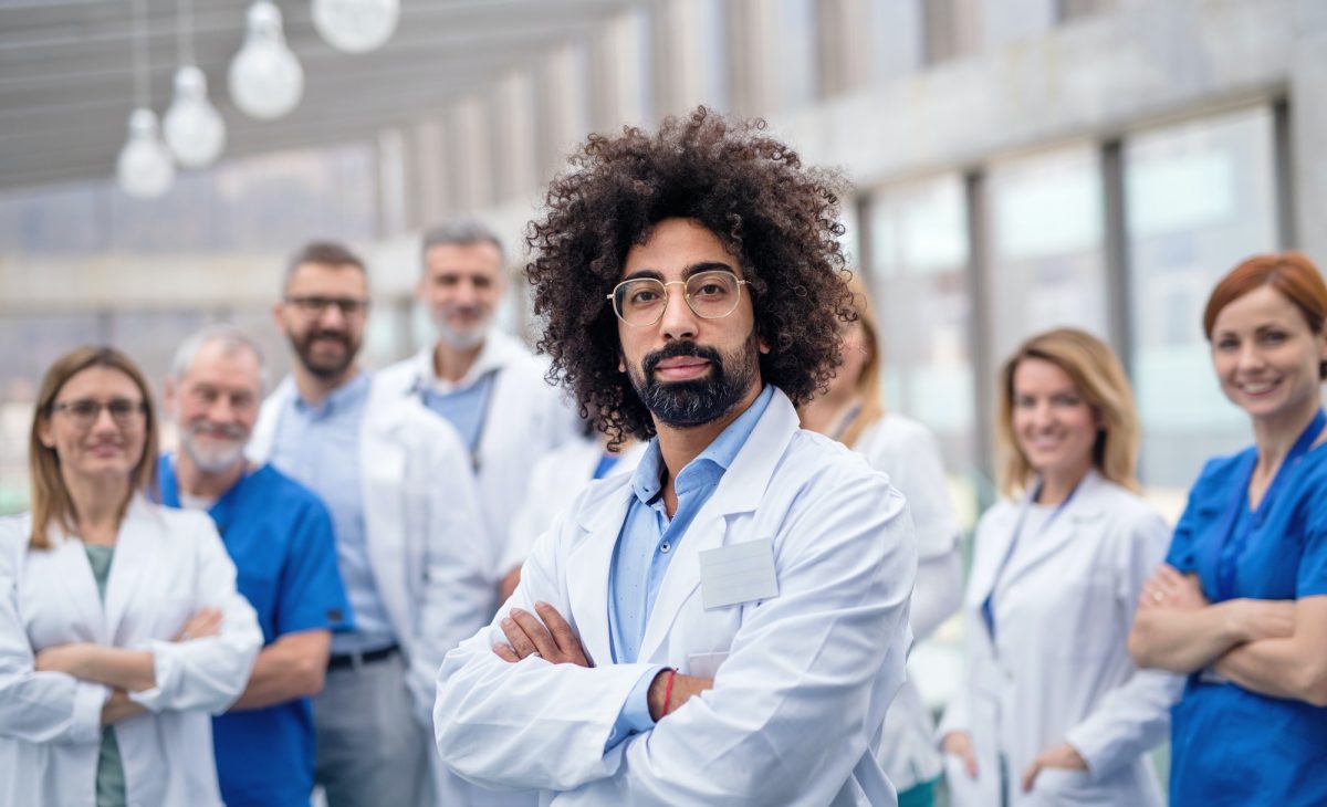 group-of-doctors-standing-in-corridor-on-medical-conference.jpg